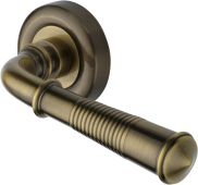 V1936-AT Heritage Brass Door Handle Lever Latch on Round Rose Colonial Reeded Design Antique Brass finish