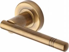 V2100-AT Heritage Brass Door Handle Lever Latch on Round Rose Alicia Design Antique Brass Finish